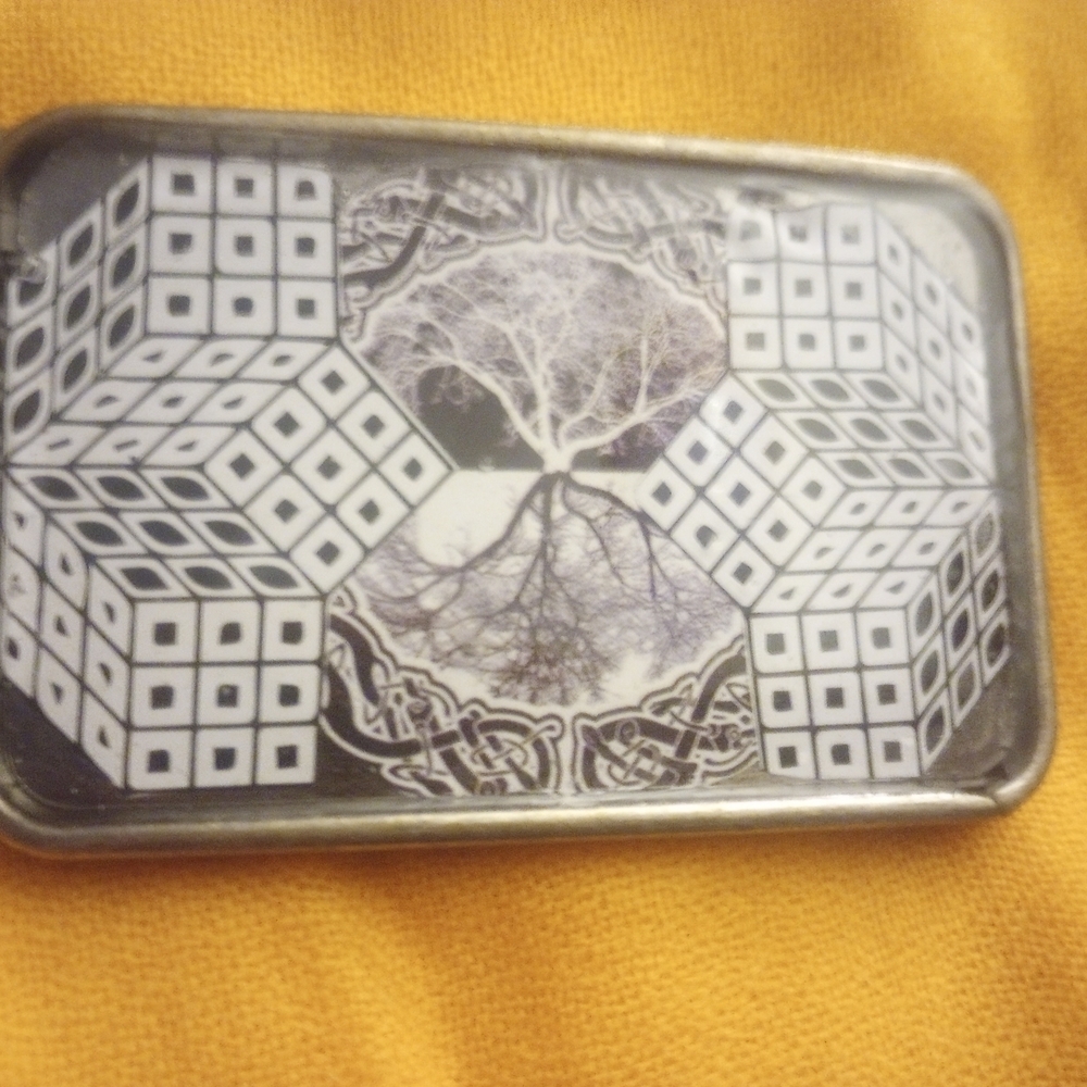 Decorative Black and White Belt Buckle with Tree and Geometric Dice Motif